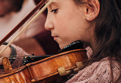 closeup of a girl playing a violin